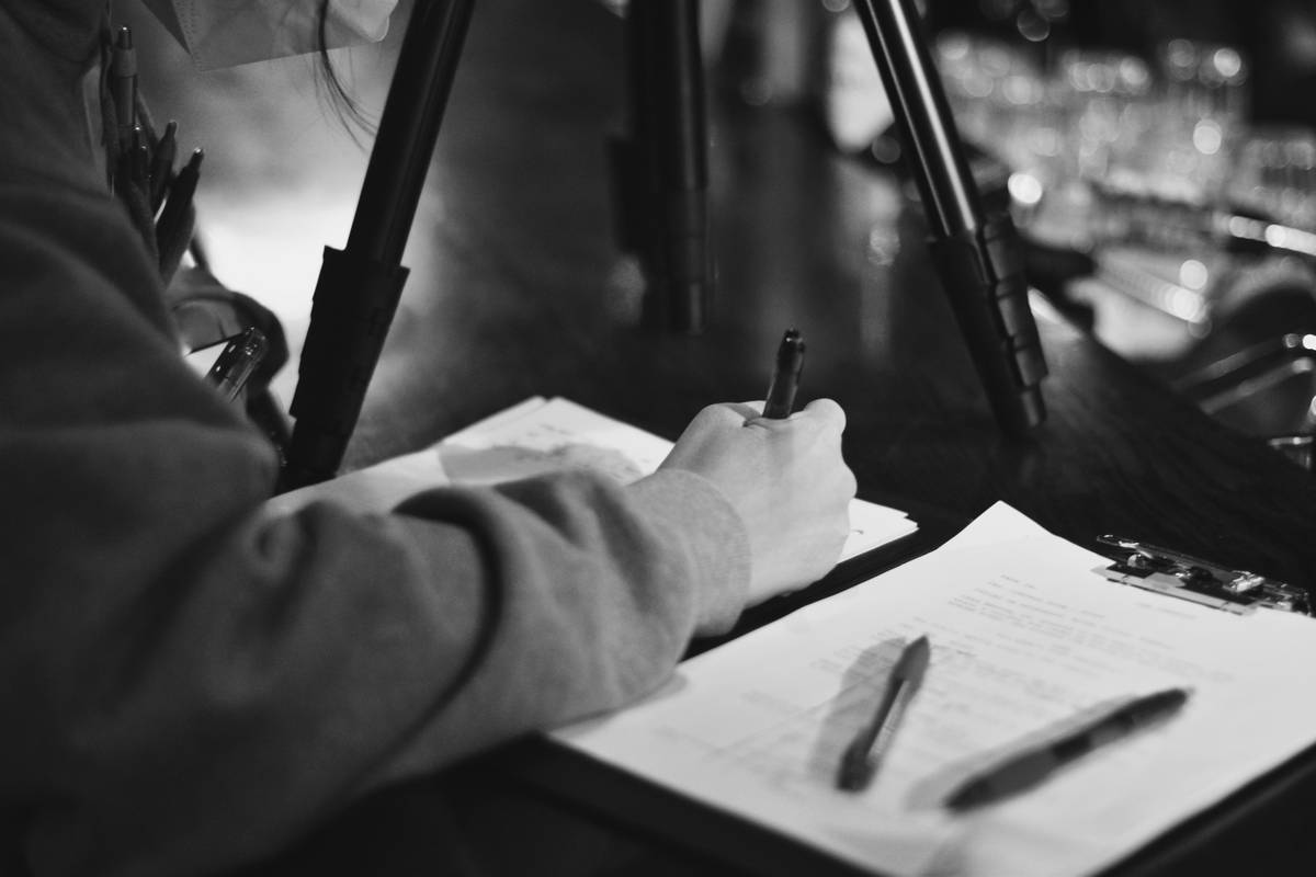 coverage limit residential burglary not subject - homeowner reviewing insurance policy documents with highlighted exclusions
